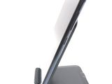 a cell phone that is sitting on top of a stand