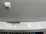 a close up of a car ' s rear bumper with a number plate