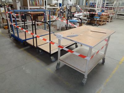 a cart with a table on it in a warehouse