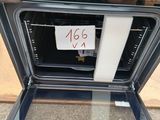 a sign on the door of an oven that is not in the oven