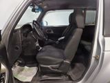 a picture of the inside of a car with the door open