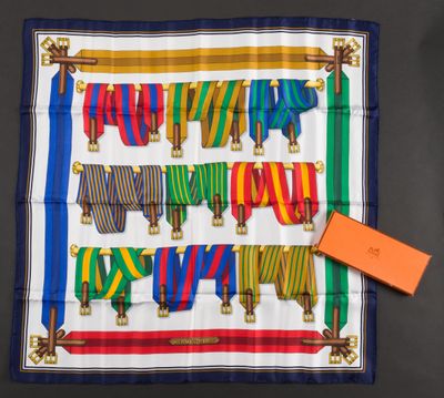a colorful scarf with a tag on it and a tag attached to it