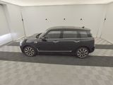 a picture of a car in a garage with a checkered floor