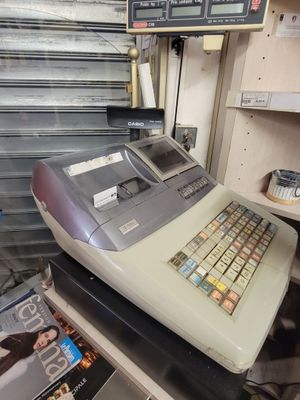 a cash register sitting on a counter in a store