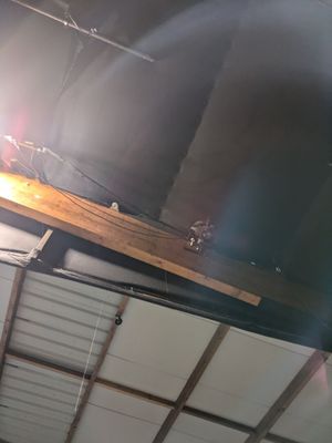 a fire hydrant that is on the ceiling of a building
