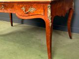 a small desk with a drawer on top of it