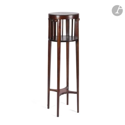 a wooden table with a round top and a wooden base