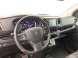 a dashboard of a car with a steering wheel and dashboard controls