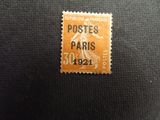 a close up of a postage stamp on a black surface