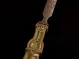 a knife that is sitting on top of a piece of cake