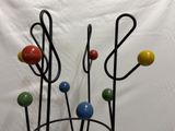 a vase that has a bunch of colorful balls in it