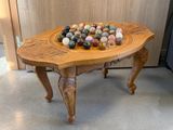 a wooden table with marbles on top of it