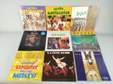 various latin music albums are arranged on a white table