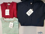 two shirts and a t - shirt with a price tag on them