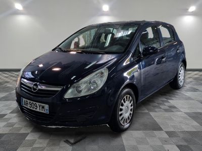 a picture of a small blue car parked in a garage