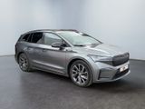 a silver car is parked in a room with a black floor