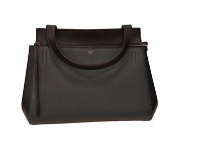 a brown leather handbag on a white background