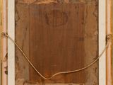 an old picture frame with a piece of wood in it