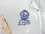 a close up of a plate with a piece of paper on it