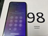 an iphone is sitting on top of a box with the number 98 on it