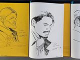 sketches of a man in a suit and tie on a yellow book