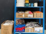 a blue shelf with many different types of wires on it
