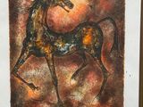 tableau représentant un cheval, dans un cadre doré, sur fond marron