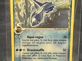 a pokemon card in a plastic box on a table