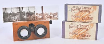 two boxes that have binoculars in them on a table
