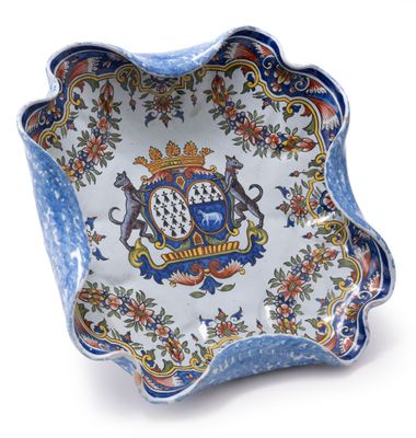 an image of a blue and white bowl with a coat of arms on it