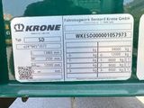 a close up of the back end of a green truck