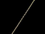 a close up of a necklace with a gold chain on a black background