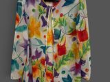 an image of a colorful jacket hanging on a hanger