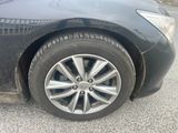 a close up of a tire on a black car