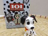 dalmatian figurine in front of a box of disney ' s 101 dalmatians