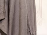 a close up view of a dress hanging on a hanger