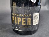 a close up of a bottle of wine on a table