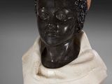 a statue of a woman with a scarf on her head