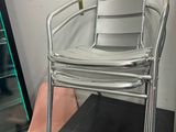 a chair that is sitting in front of a refrigerator
