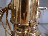 a silver vase with a chain around it