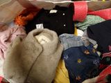 a bag full of clothes and a teddy bear in it