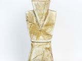 a glass vase that has a gold colored design on it