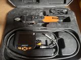 a black case with a digital device inside of it