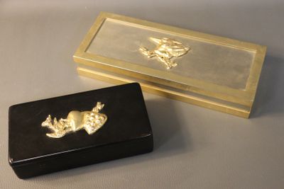 a black box with a gold design on it and a black box with a gold design on it