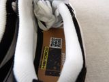 a close up of a pair of shoes with a qr code on them