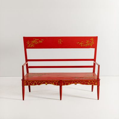 an image of a red bench with a red and gold design on it