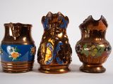 three vases sitting next to each other on a table