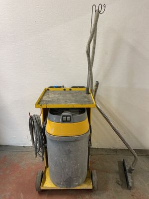 an image of a yellow and black vacuum cleaner in a room