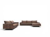 two pieces of brown leather couch and loveseat on a white background