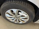 a close up of a tire on a car with a sticker on it